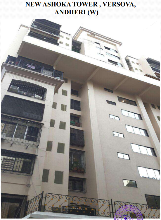 Upward view of New Ashoka Tower high-rise residential building in Versova, Andheri (W) with balconies and barred windows.